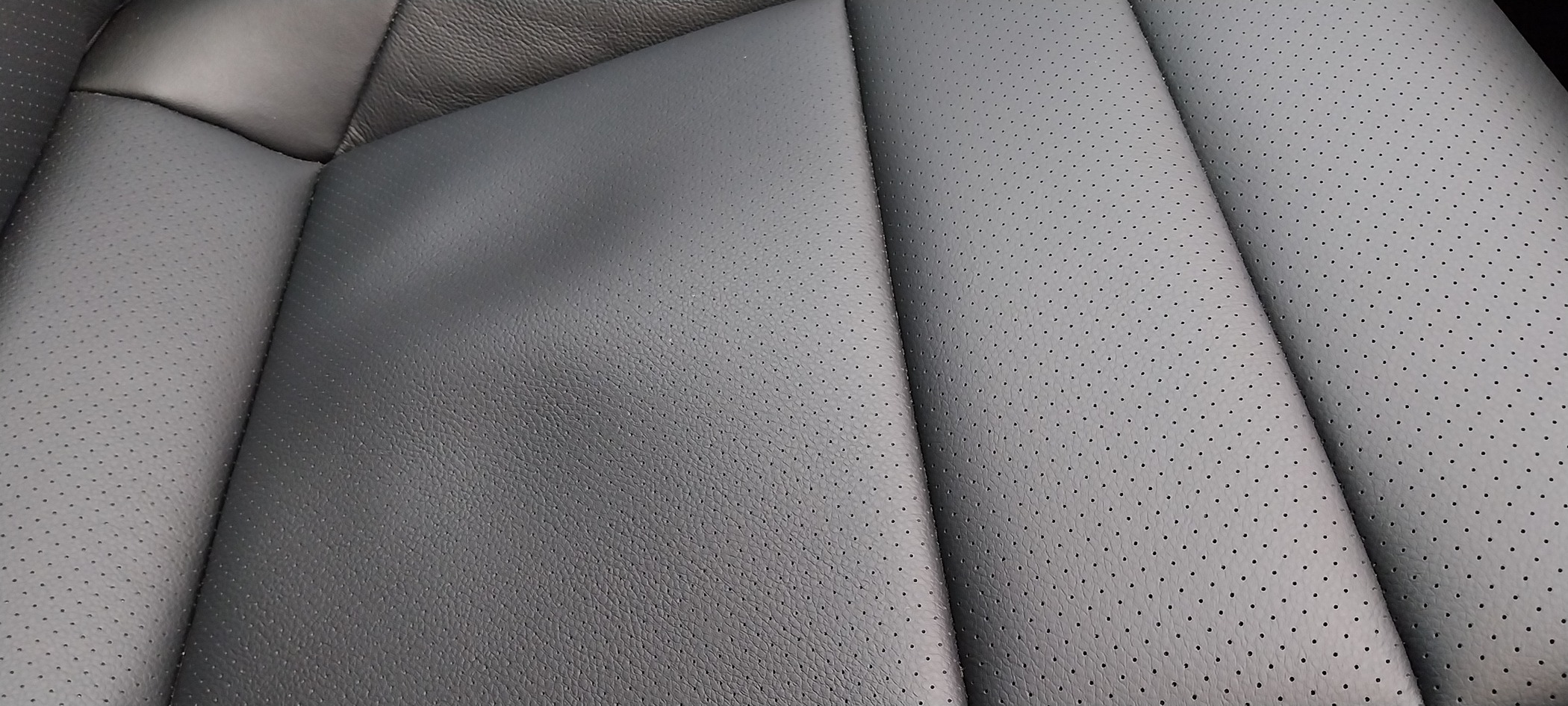 Porsche Taycan Loose leather at base of seat 20240215_081124