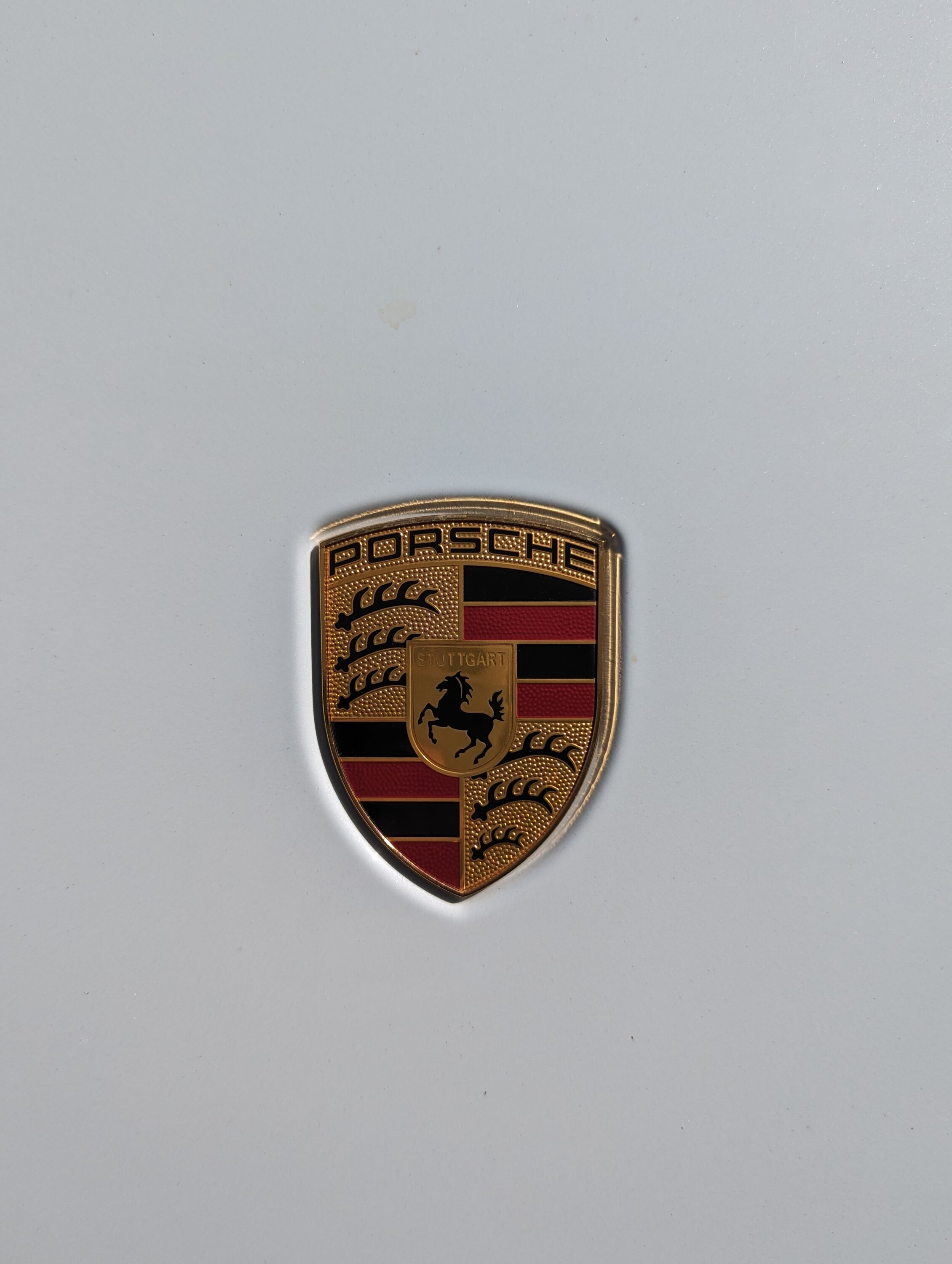 Porsche Taycan Need monochrome replacement hood emblem PXL_20230831_224806376