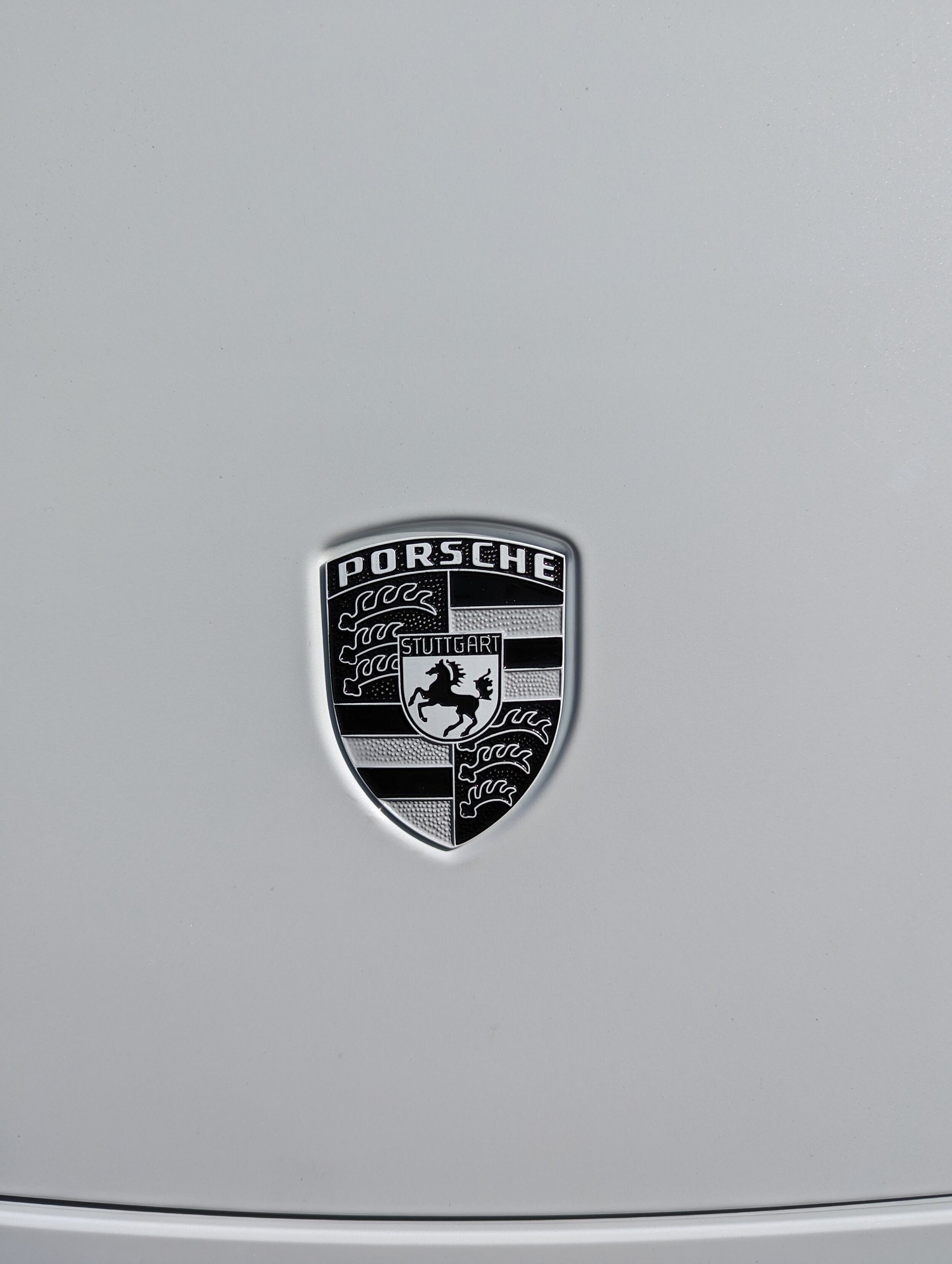 Porsche Taycan Need monochrome replacement hood emblem PXL_20230831_230123921